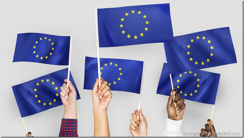 Hands waving flags of the EuropeanUnion